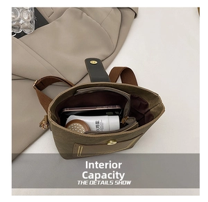 Top view of the interior compartment showing capacity for cosmetics and a smartphone