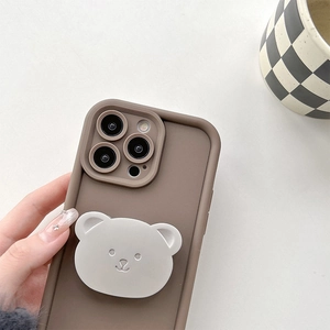 Detail of dark brown silicone iPhone case with a cute 3D bear stand and grip