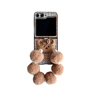 Colorful tweed flip phone case with plush bear and pearl faux fur ball wrist strap