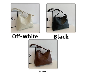 Detail of geometric textured tote bag showing off-white, black, and brown leather styles