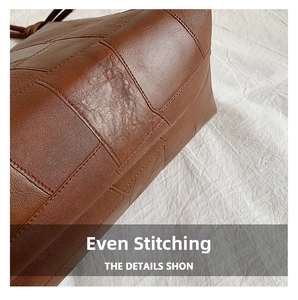Macro detail of brown leather tote bag with quilted stitching and lychee texture