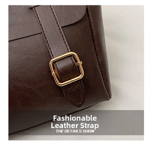 Detail of dark brown leather texture with high-quality gold square metal buckle and strap