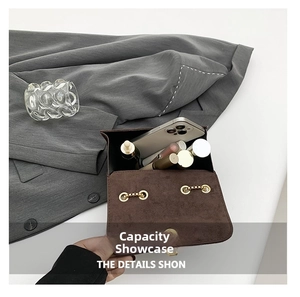Detail view of coffee suede square bag interior showing capacity for smartphone and makeup
