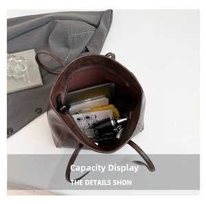 Top view of spacious brown leather tote showing interior storage for laptop and daily items