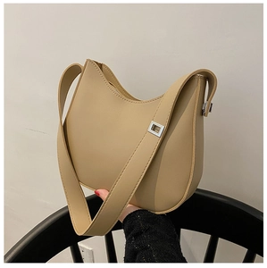 Detailed view of the khaki hobo bag featuring a silver metal buckle and sleek matte finish