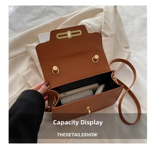 Detail showing the spacious interior capacity of this vintage brown PU leather crossbody bag