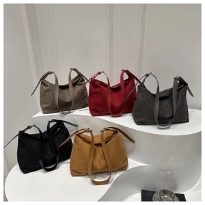 Detail shot of multi-color minimalist canvas tote bags with adjustable metal buckles