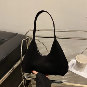 Minimalist black matte hobo bag for women with suede texture and shoulder strap