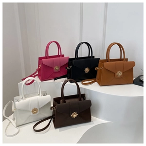 Detail view of structured tote bags in five colors with floral gold metal clasps