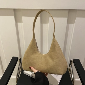 Minimalist camel hobo bag with matte suede texture and rounded half-moon silhouette