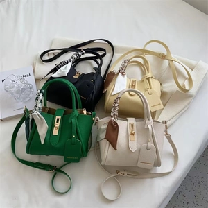 Minimalist bucket bags in four colors with floral scarves and metal twist lock hardware