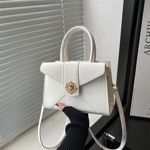 Minimalist white PU leather handbag with gold petal clasp and adjustable shoulder strap