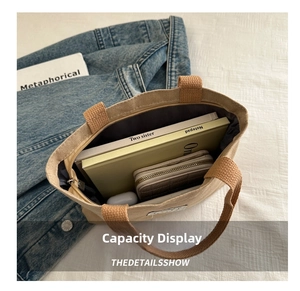Top view of canvas tote bag interior showing ample storage for wallet and notepad