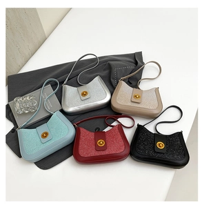 Top view of sequined underarm bags in blue, silver, beige, burgundy and black