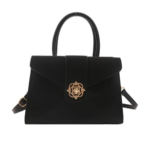Classic black crossbody square bag with gold circular buckle and adjustable strap