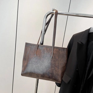 Vintage dark brown faux leather tote bag with waxed texture for commuting use