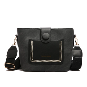 Fashionable black matte bucket bag with contrast stitching and woven shoulder strap