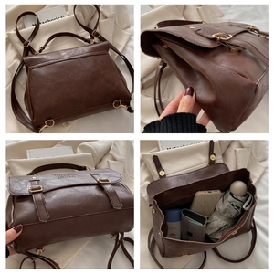 Detail view of large capacity dark brown retro backpack showing interior storage and hardware