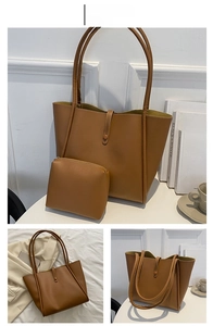 Detail view of khaki minimalist tote bag set with matching zipper pouch on white background