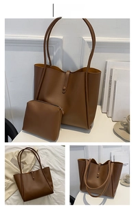 Detail of dark brown tote bag set with matching pouch and stylish shoulder strap design