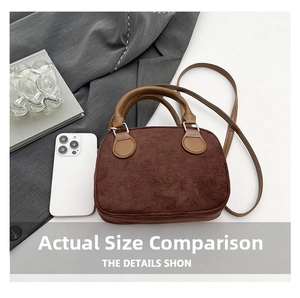 Top view of retro dark brown matte bowling bag with smartphone for size comparison