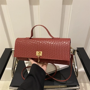 Minimalist red brown woven texture crossbody bag with gold buckle and top handle