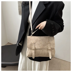 Vintage beige textured backpack with double buckle straps and versatile top handle carry