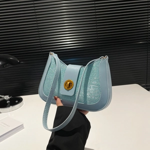 Sparkly light blue sequin underarm bag with gold lock and sleek leather strap