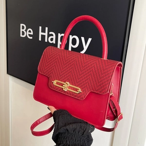 Retro red crossbody bag with herringbone pattern flap and golden metal lock closure