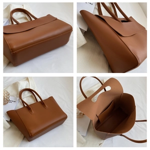 Detail view of large caramel tote bag showing spacious interior and premium leather texture