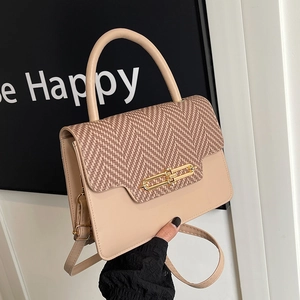 Vintage beige handbag with herringbone pattern flap and golden metal clasp for women