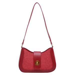 Sparkly red glitter shoulder bag with gold metal clasp and smooth leather trim