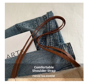 Close-up of the plush tote bag showing premium leather straps and soft faux fur texture