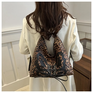 French leopard print shoulder bag with vintage bow and black butterfly lace-up detail
