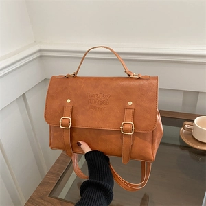 Retro brown leather tote backpack with magnetic buckle and lucky lettering logo