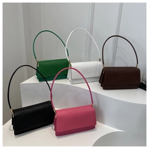 Minimalist baguette shoulder bags in five colors displayed on geometric podiums