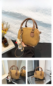 Detail of brown corduroy bowling bag with plush bear charm and detachable strap