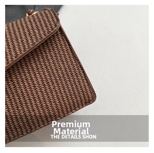 Close-up of premium woven texture on brown crossbody bag showing fine craftsmanship