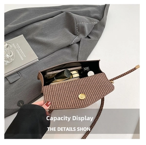 Brown woven texture crossbody bag interior showing storage space for phone and makeup
