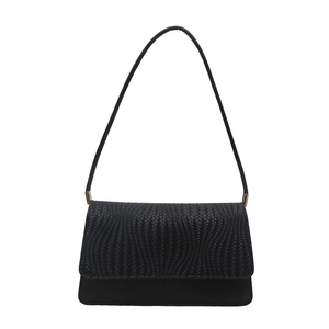 Minimalist black faux leather shoulder bag with geometric woven texture on the front flap