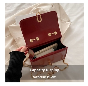 Internal capacity of burgundy matte leather crossbody bag showing smartphone storage space