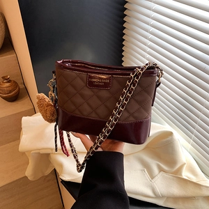 Retro quilted chain shoulder bag in brown and burgundy leather with a plush bear charm