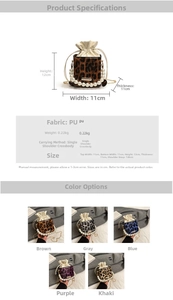 Detail view of leopard print bucket bag with large pearl handle and golden chain strap