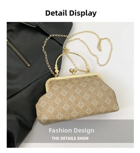 Close-up of retro khaki shell bag featuring floral patterns and gold metal top handle