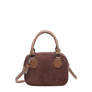 Vintage brown suede pillow handbag with adjustable shoulder strap and silver hardware
