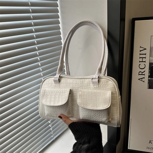 Minimalist white crocodile embossed underarm bag with double front pockets and twin handles