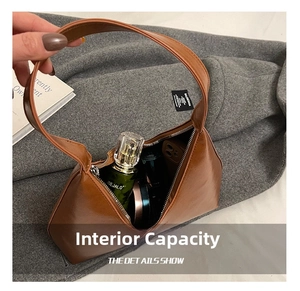 Detailed view of spacious brown leather hobo bag interior showing daily essentials