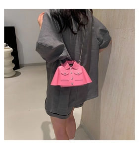 Rear view of a pink blazer-shaped crossbody bag with a metal chain and button detail