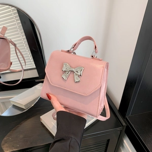 Pink bow square handbag for women with silver metallic accent and shoulder strap