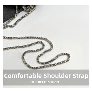 Close-up of elegant silver wheat chain strap with textured woven metal details